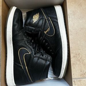 Nike Air Jordan Black and Gold High-Top Sneakers